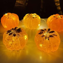 Handmade orange glitter resin pumpkin with small led lights inside. Gold glitter to top of pumpkin and gold colour stalk.