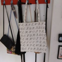 handmade tote bag made in a cream and black alphabet fabric
