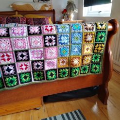 Throw made using multi coloured granny squares